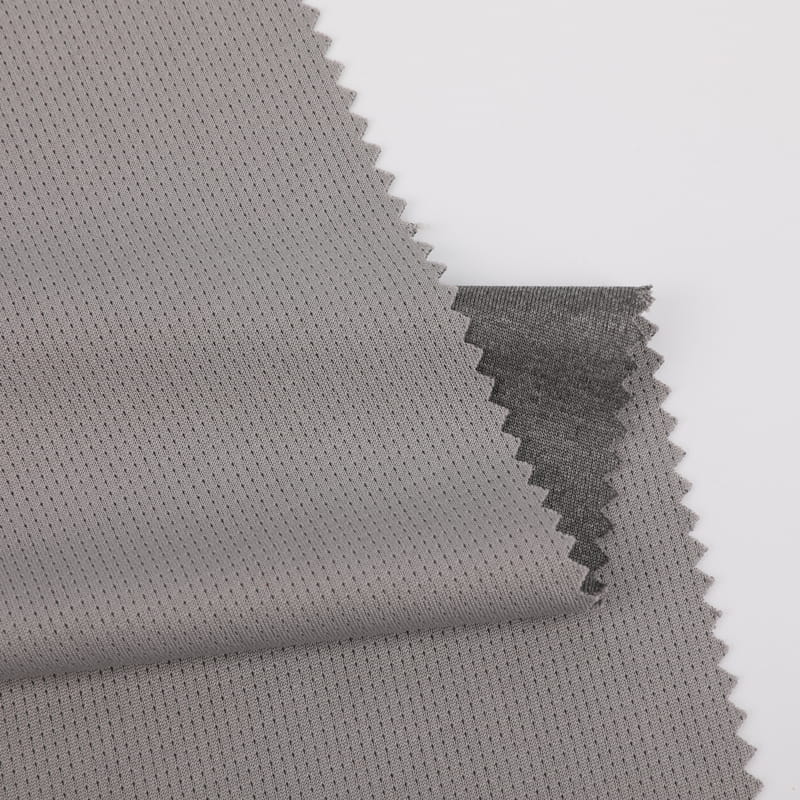 Tissu maille à œillets gris chiné cationique